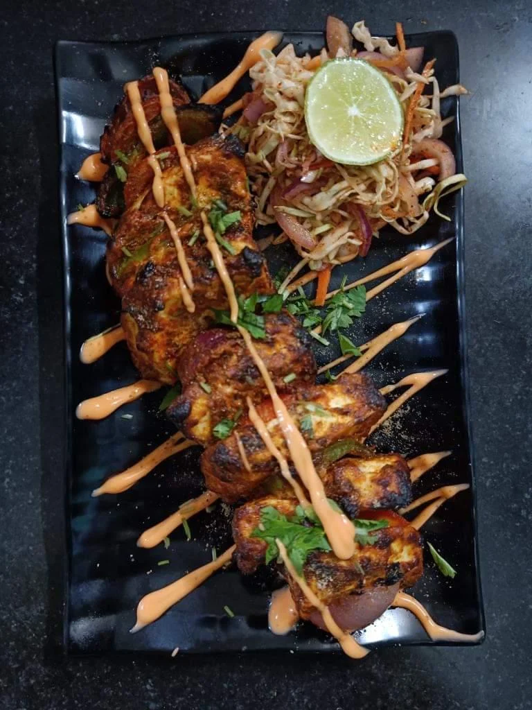 Signature grilled chicken platter served at Swiss Kitchen, Bhanjanagar
